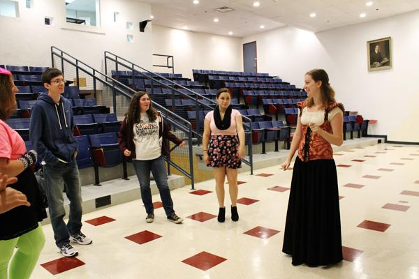 Ms. Jessica Ruggles (right) works with her  theater students. 