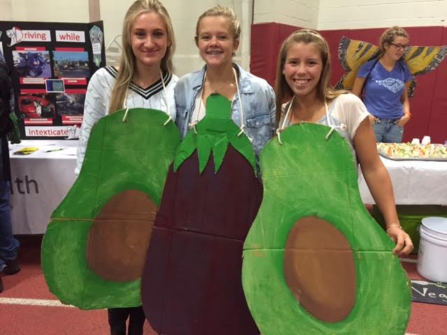 (From left) Marlaina Fulmer, Julia Wood, and Rachel Alexander promoting healthy eating at the health fair