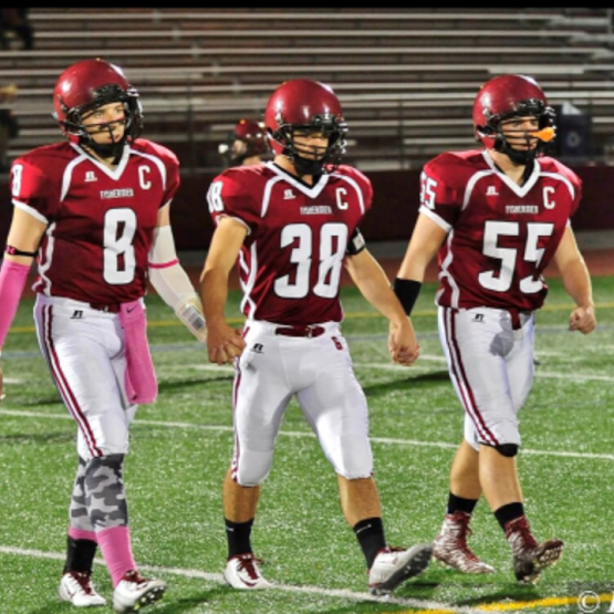 (from left) Senior football captains Mike Cody, Alex Enes, and Thomas Donahue 