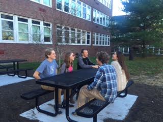 Seniors enjoy the new tables outside the cafeteria during lunch