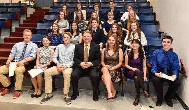 High-achieving students pose for a photo with Principal Erik Anderson on Wednesday night  