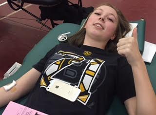 Hailey Muniz donates blood to show her support