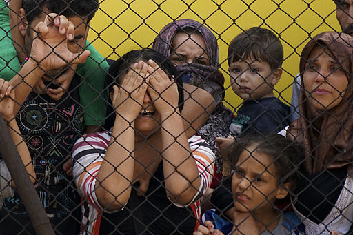 Women_and_children_among_Syrian_refugees_striking_at_the_platform_of_Budapest_Keleti_railway_station._Refugee_crisis._Budapest,_