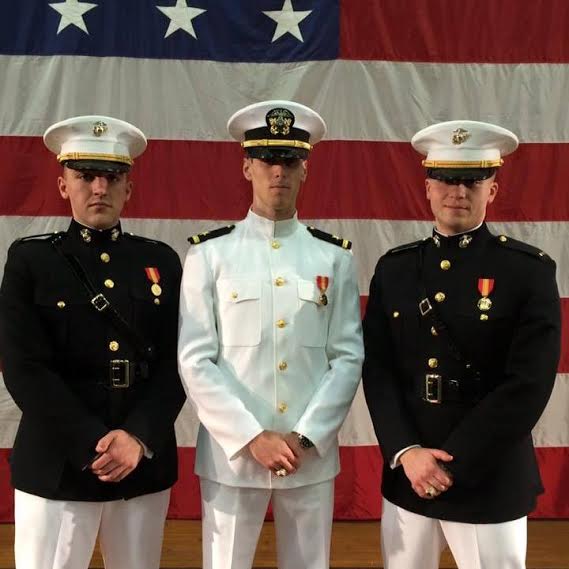 GHS graduate Evan Goss (center) was Commissioned an Ensign in the US Navy