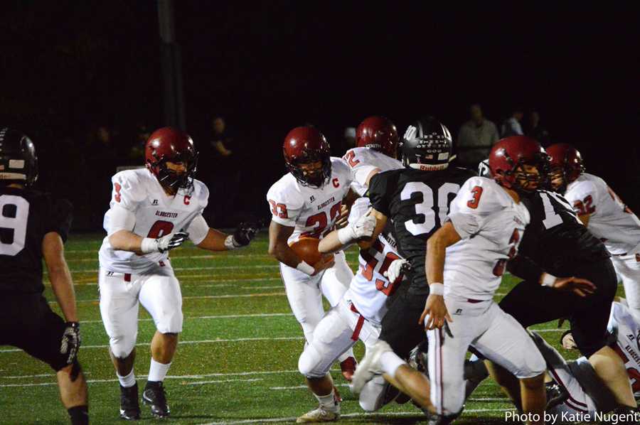 Captain Jermaine Edwards (33) rushes up the field after being handed the ball by Nate Young
