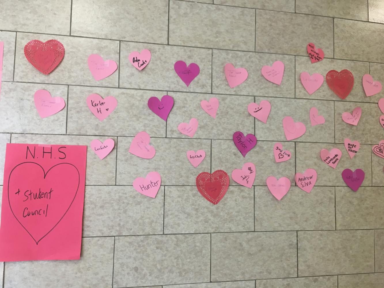 Hearts adorn the wall outside of the school store.