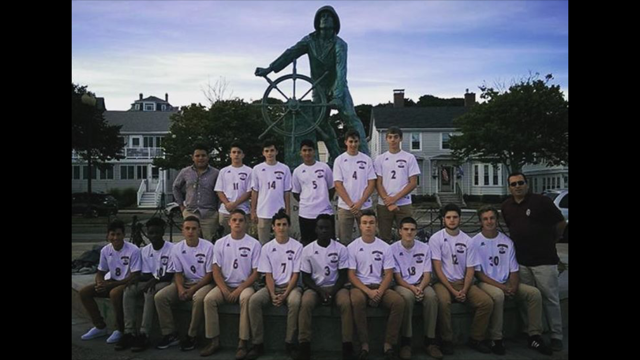 GHS Soccer team poses in front of Fisherman Statue