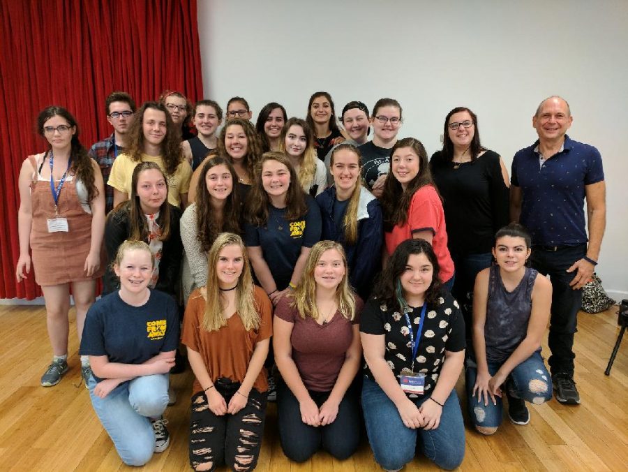 Drama club poses with first stage manager for Hamilton on their recent trip to NYC