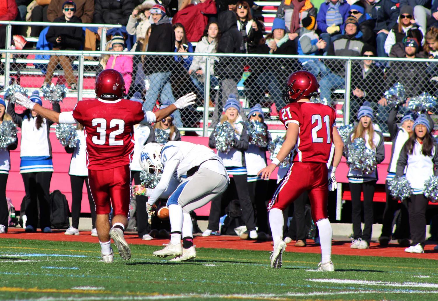 Marc Smith (32) and Harrison Marshall (21) stop the Falcons from converting on an important 4th down conversion