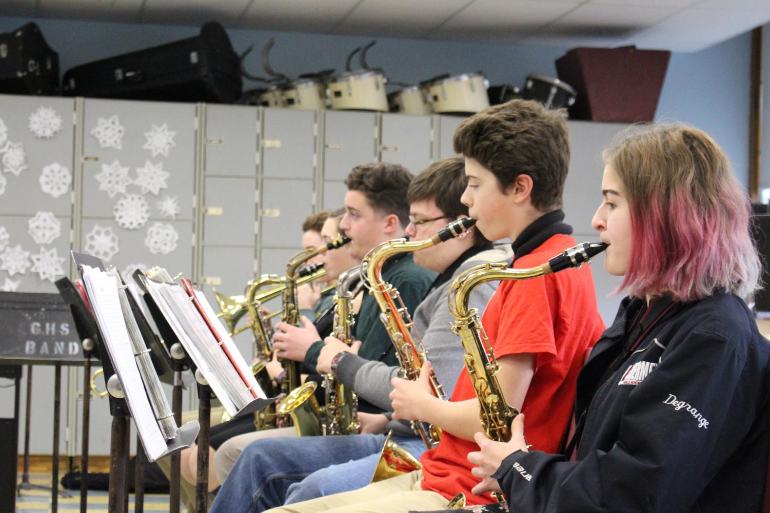 (from left) Sam Groleau , Kelsey Lowthers, Ivan Demarjian, Logan Wieckowski, Owen Hardy, and Rose Degrange practice scales during music class