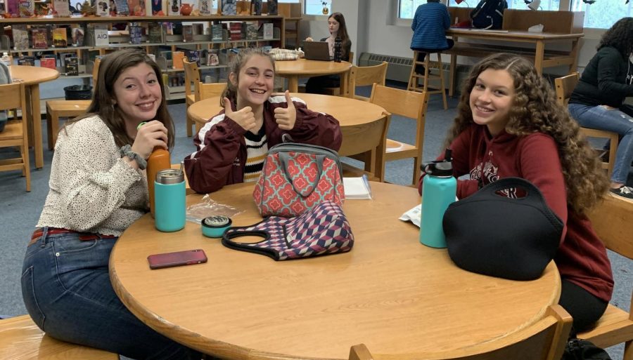 (from left) Asha Egmont, Isabella Giordano, and Haley Weed enjoy lunch in the Library Learning Commons