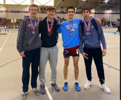 Daniel Hafey, Andrew Coelho, Harrison Pelosi and Kai Deguzman pose with their medals after the NEC Championship