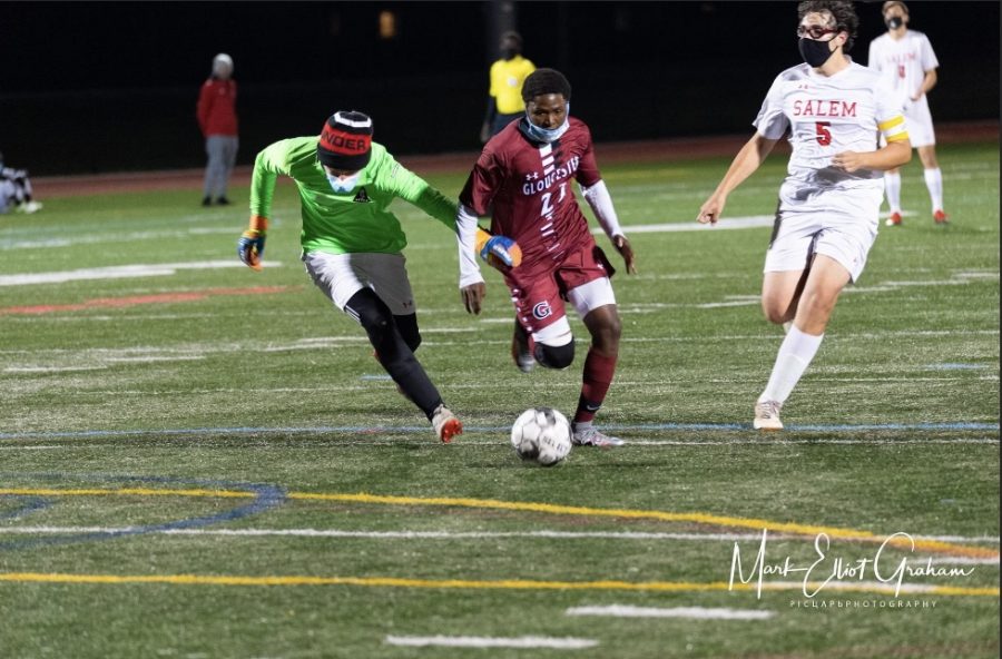 Senior Robert Mugabe rounds the keeper to score  his second goal of the night
