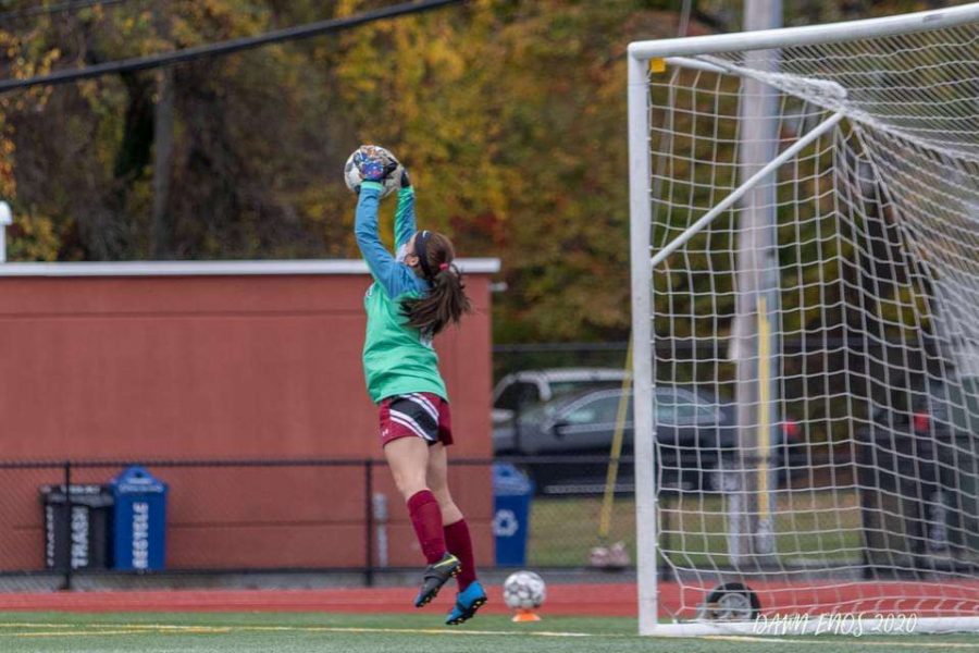 Freshman Aleena Dort makes a leap for the ball while playing goalie a few weeks ago.