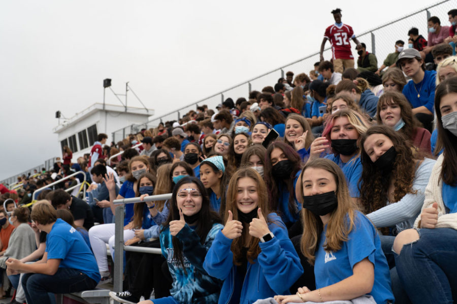 The junior class shows its school spirit dressed in blue while awaiting dismissal after evacuation on Friday.