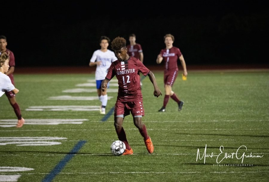 Geremy Palacios, shown taking the ball up the field, had his first career hat trick on Saturday against Dracut 