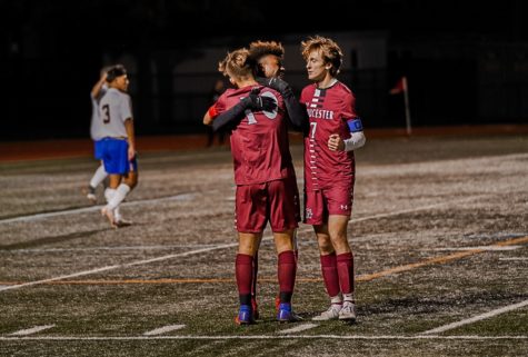  Andrew Coelho celebrates with teammates Geremy Palacios and Aidan Almeida after scoring and breaking the record for most goals in a season 