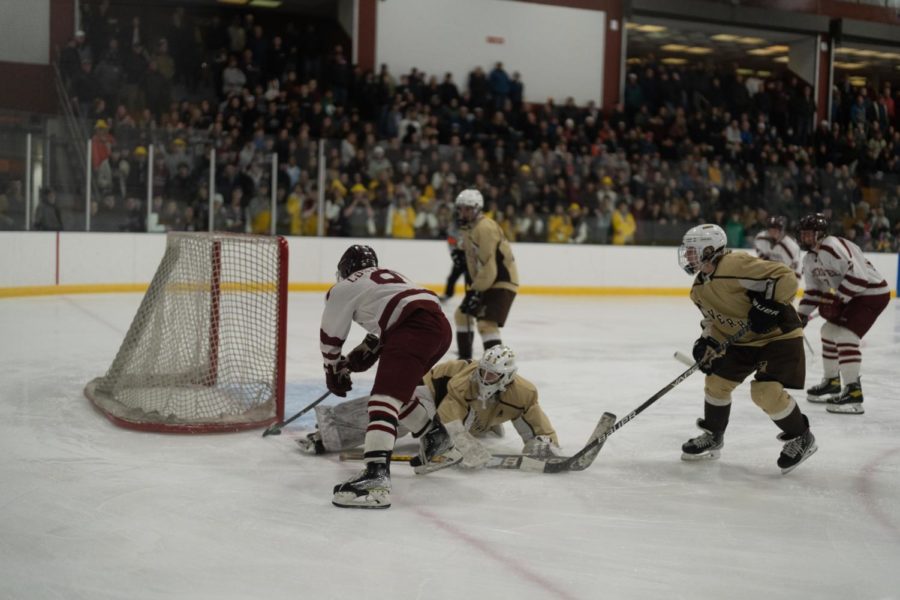 Jack Costanzo attacks the net to put pressure on the Hillies