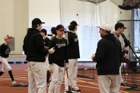 Gloucesters Adam Borowick speaks with members of the baseball team during their first day of tryouts