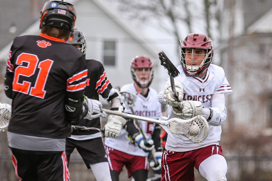 Gloucester defenseman Nick Carey attacks the ball.