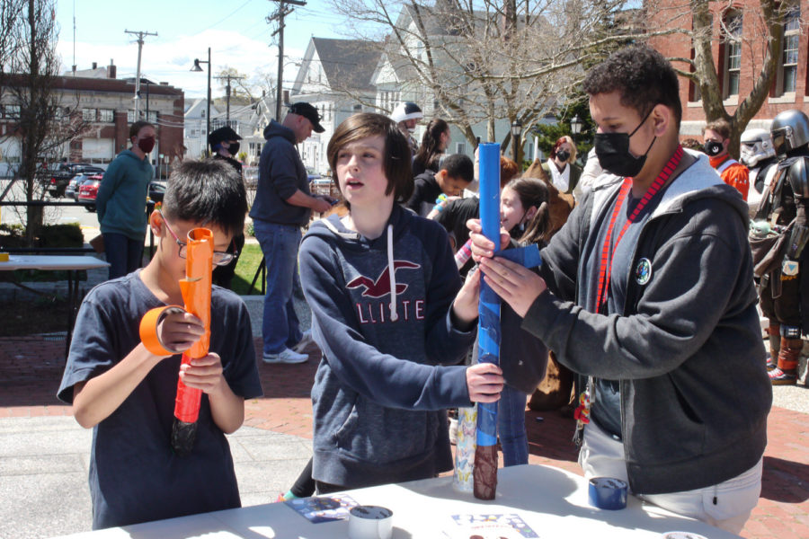 Students make light sabers in the amphitheater