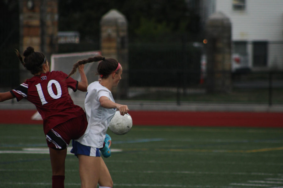 Ava Coelho fights for the ball with a Danvers player.