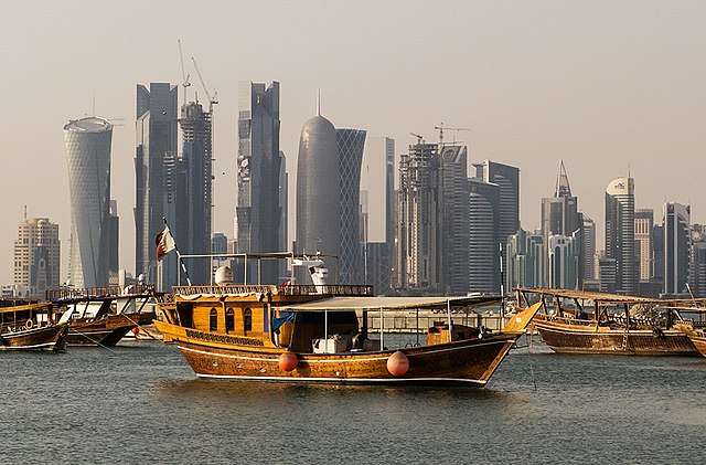 Dhow boats in front of the West Bay skyline as seen from the Corniche, in Doha, Qatar.