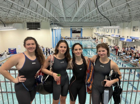 Swimmers Willow Barry, Esme Sarrouf, Sarah Fernandes, and Anna Patrick pose for a picture after competing in sectionals.