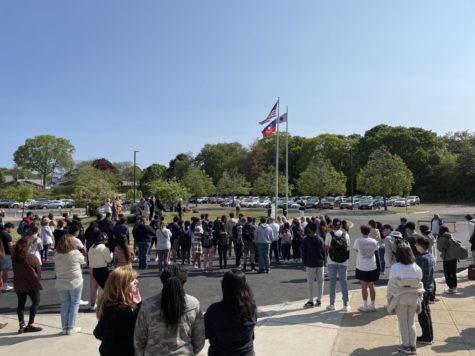 Students witness the raising of the flag to honor Juneteenth.