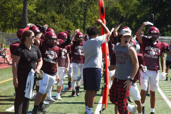 The team celebrates after a touchdown against Essex Tech. 