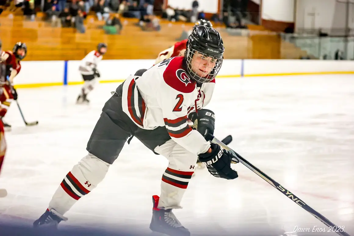 Lily Pregent brings the puck around the back of the net.