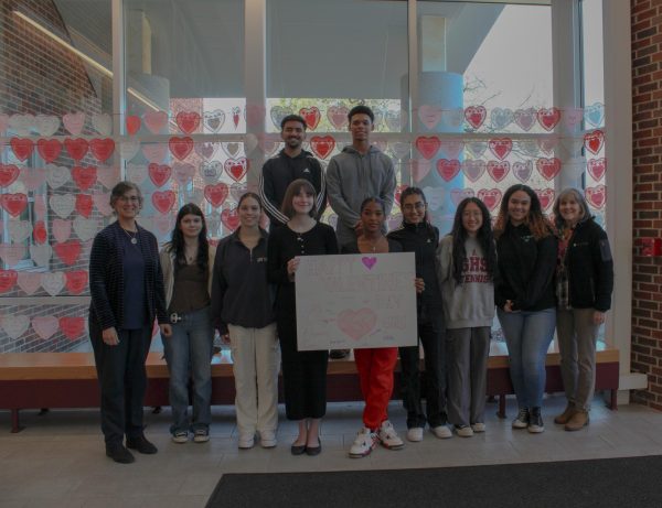 YAC poses with the atrium decorations before Valentines Day