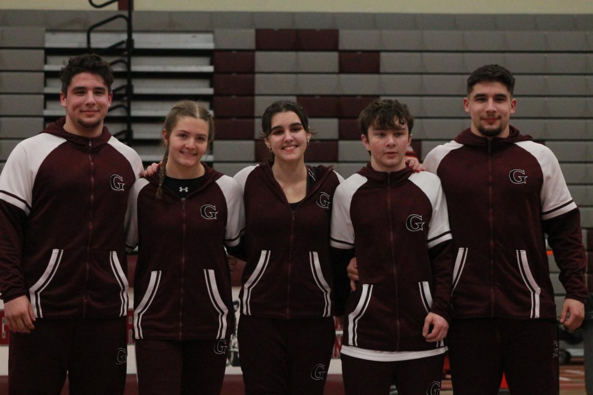 Wrestling Seniors pose for a group picture