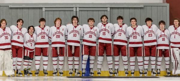 Boys Hockey Team poses for photo on Senior Night.