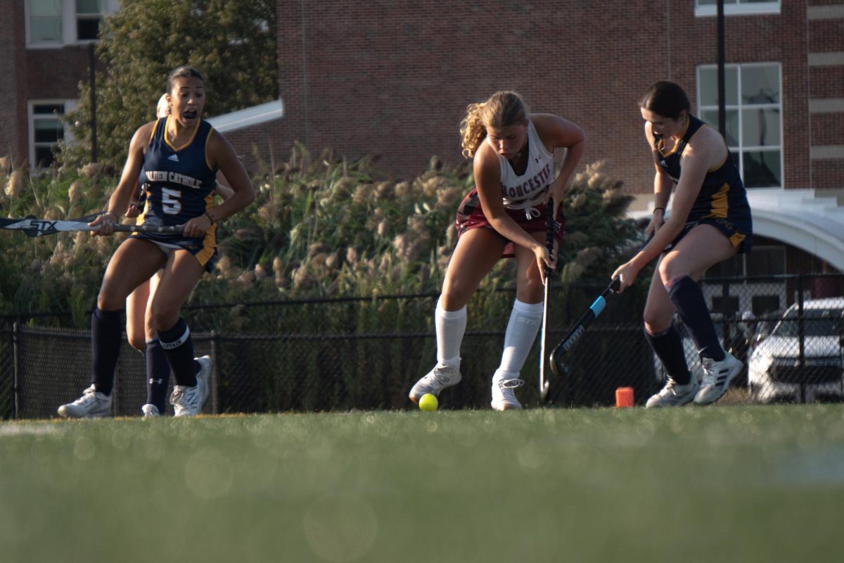 Mackayla Allen attempts to dribble through a Lancer defender during Thursday's match.