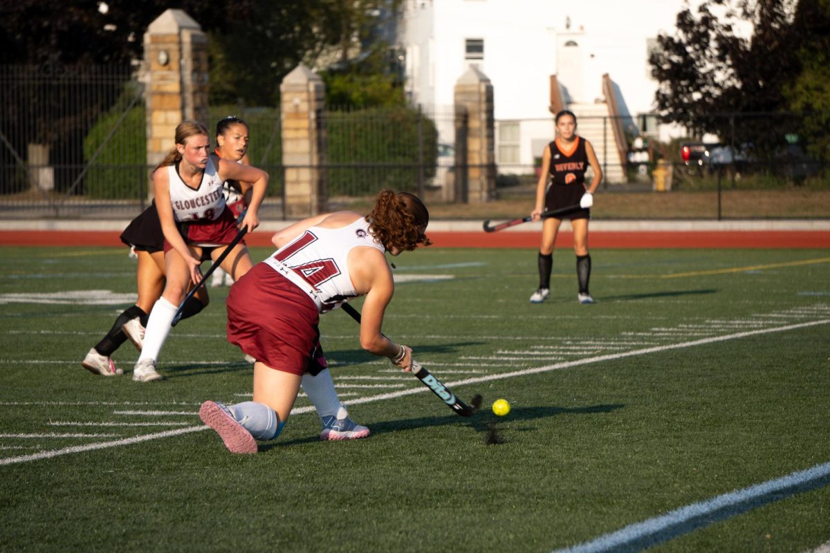 Elliana Parsons takes a free hit on the corner against the Beverly Panthers.