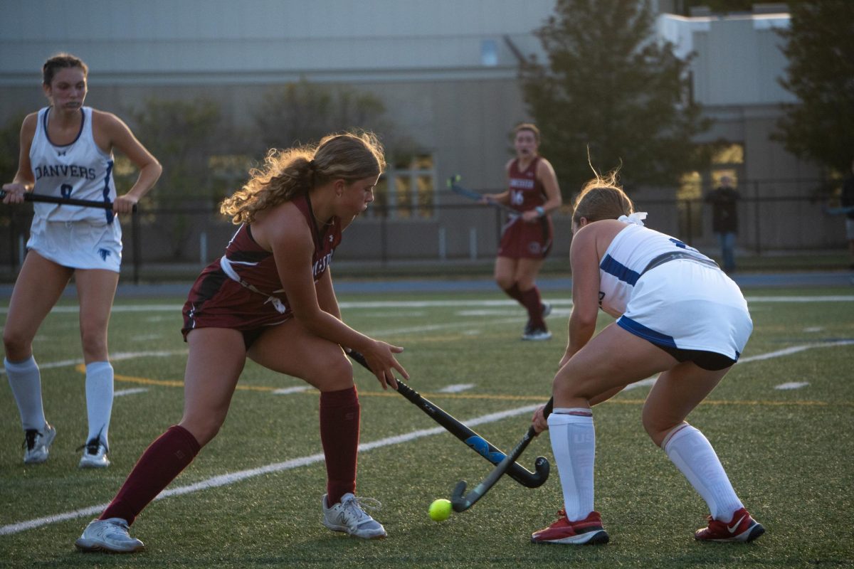 Mackayla Allen of Gloucester challenges a Danvers midfielder during last week's matchup.