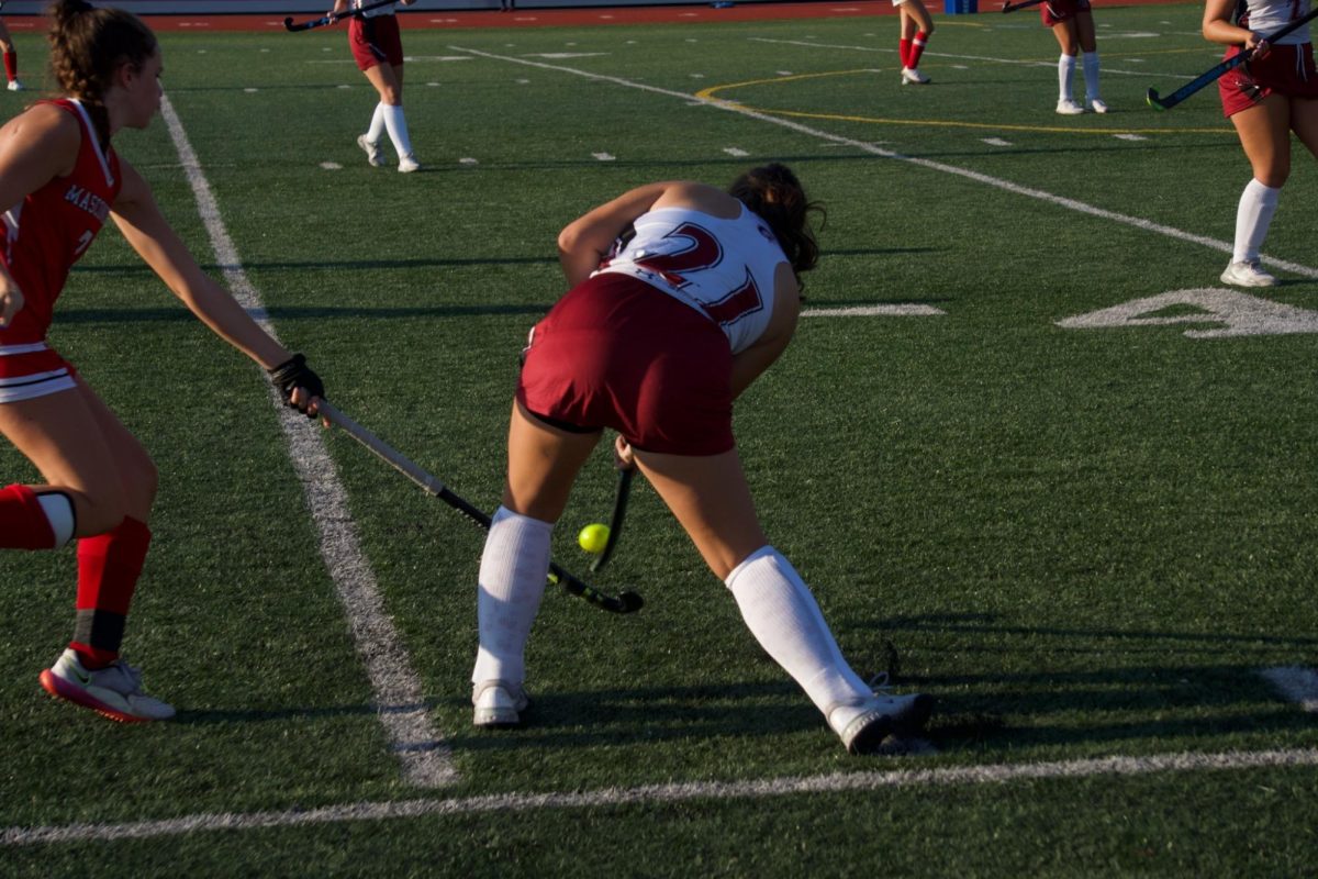 Ashlyn Orlando passes the ball through a defender in Gloucester's home opener. 