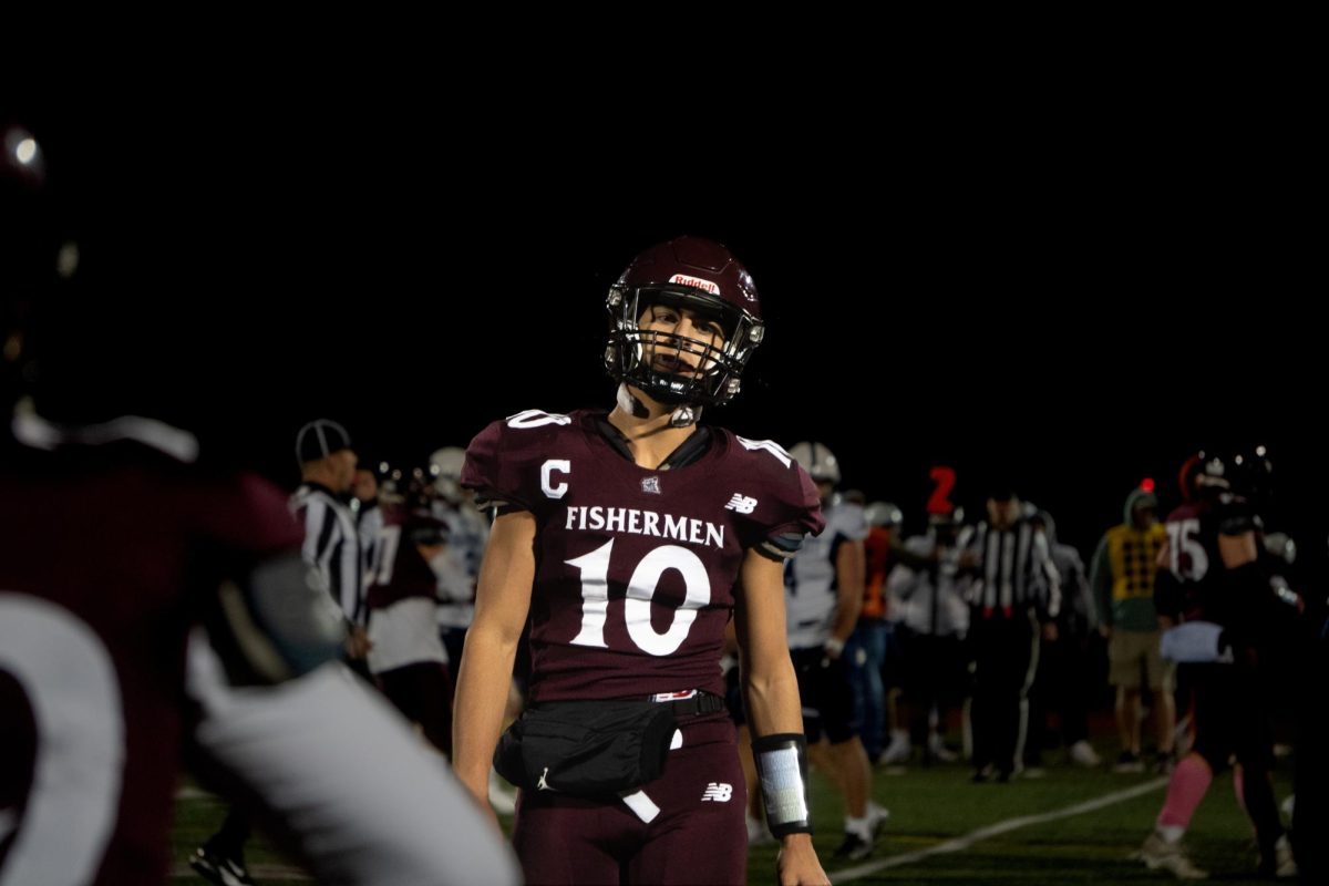 Quarterback Camryn Rodolosi walks off the field after a disappointing drive 