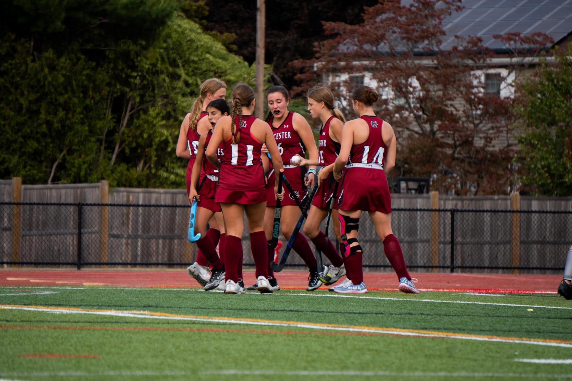 The Gloucester Field Hockey team celebrates a goal earlier this season. The team awaits their final power ranking, which doesn't have a confirmed release date.