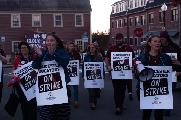 Gloucester educators march towards City Hall to announce the strike. 