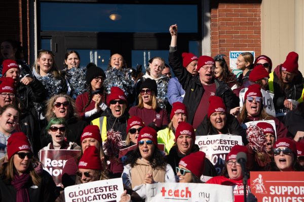 Gloucester Educators and supporters chant on the steps of City Hall.