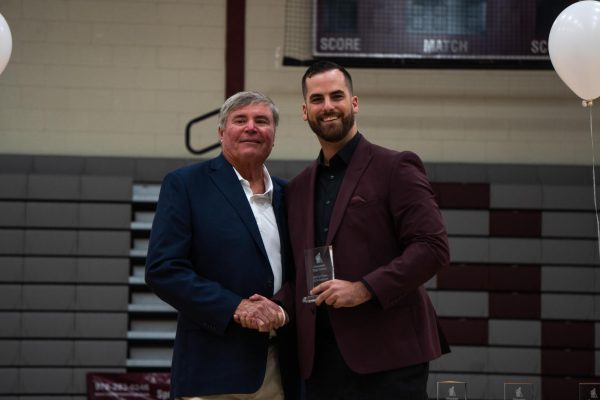 Adam Philpott, head coach of the GHS boys basketball team, accepts his award during the GHS Hall Of Fame Induction ceremony. Philpott played baseball, basketball, and football for Gloucester.