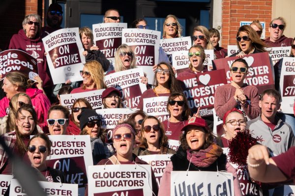 Gloucester educators chant on the steps of City Hall this afternoon.