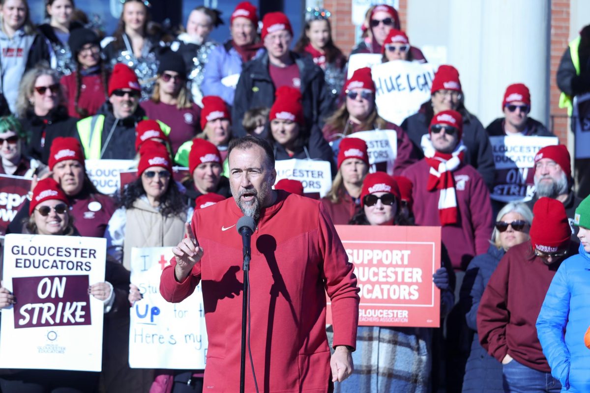 GHS Teacher Rich Francis informs the crowd that school officials are withholding pay for striking educators.  