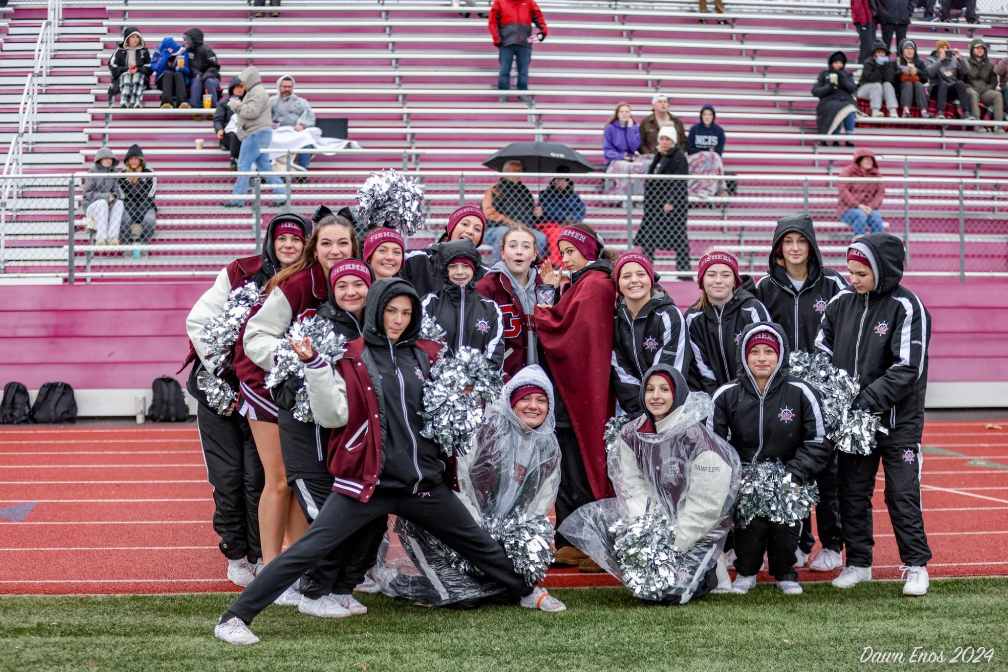 The GHS cheer team poses on the sideline during the football team's Thanksgiving matchup against Danvers.