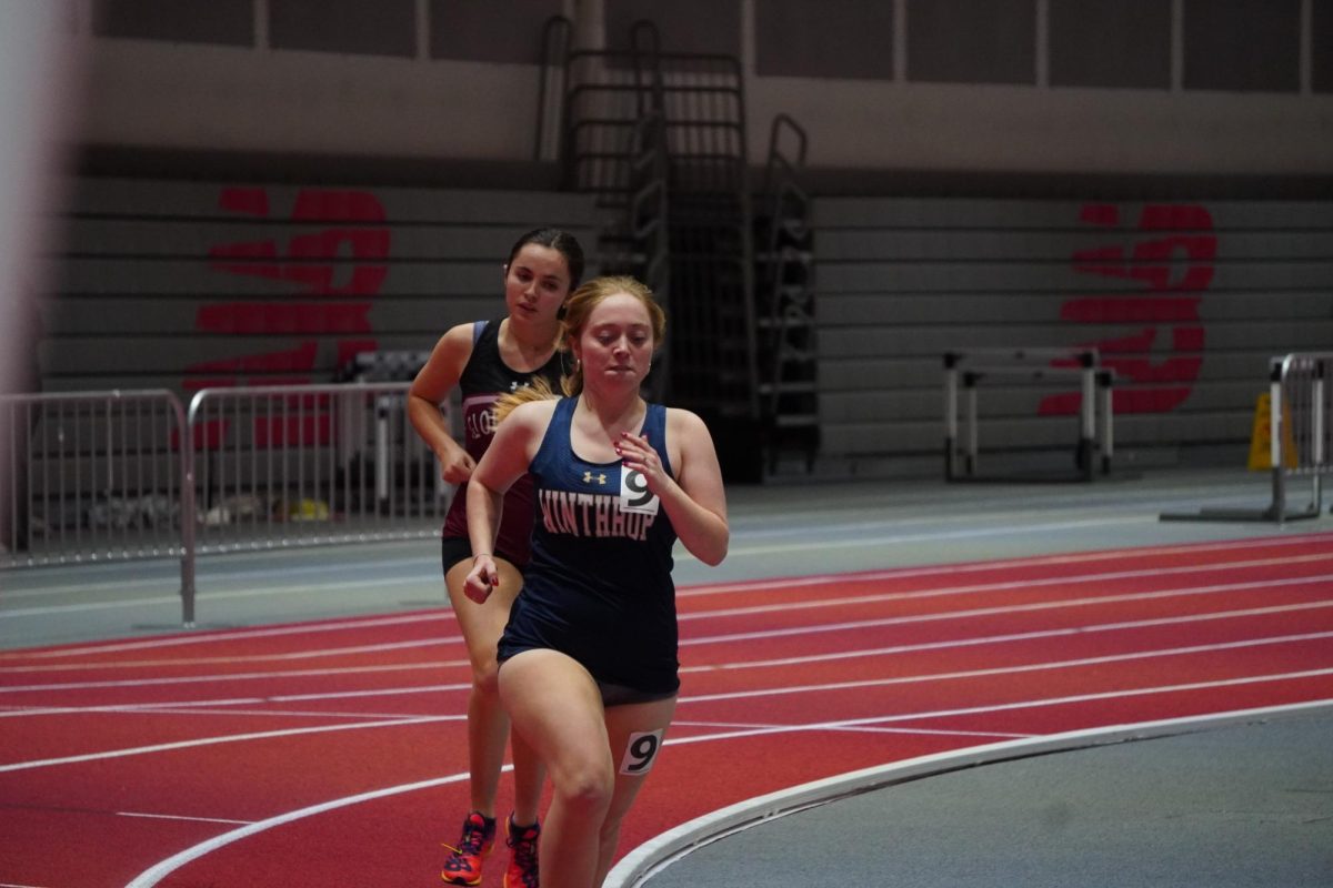 Ruby McElhenny prepares to pass a Winthrop runner in the 1000 meter.