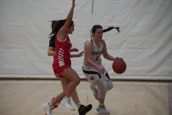 Olivia Madruga is screened by two Saugus Sachem defenders. 