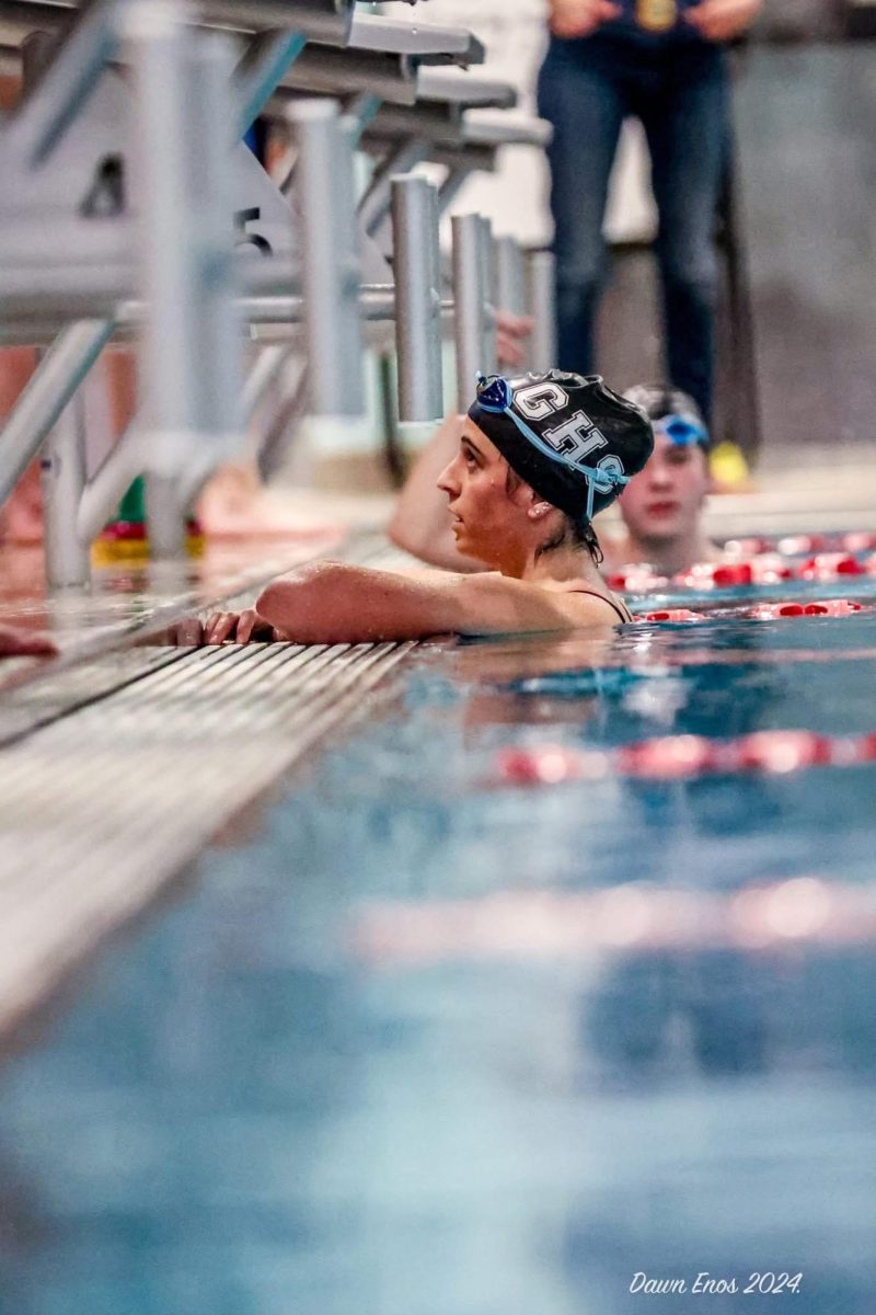 Senior Sarah Fernandes finishes her race on Senior Night last season.