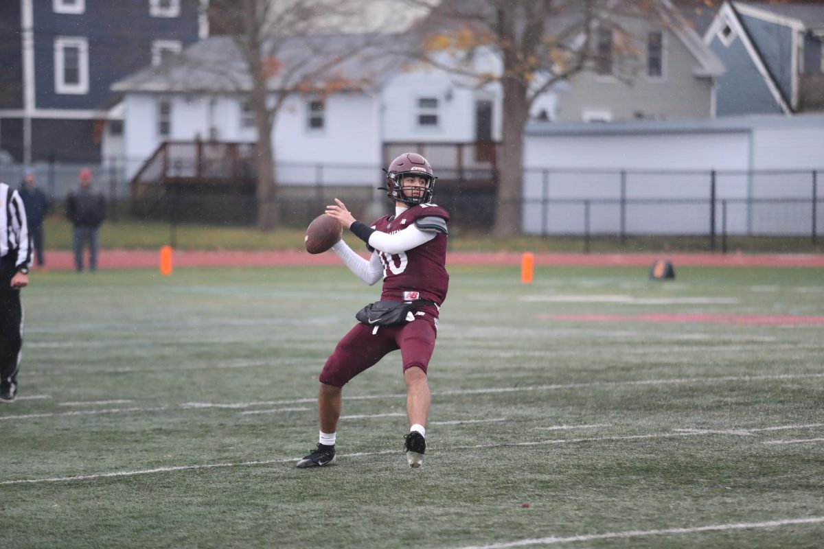 Quarterback Camryn Rodolosi prepares to throw the ball up the field. 
